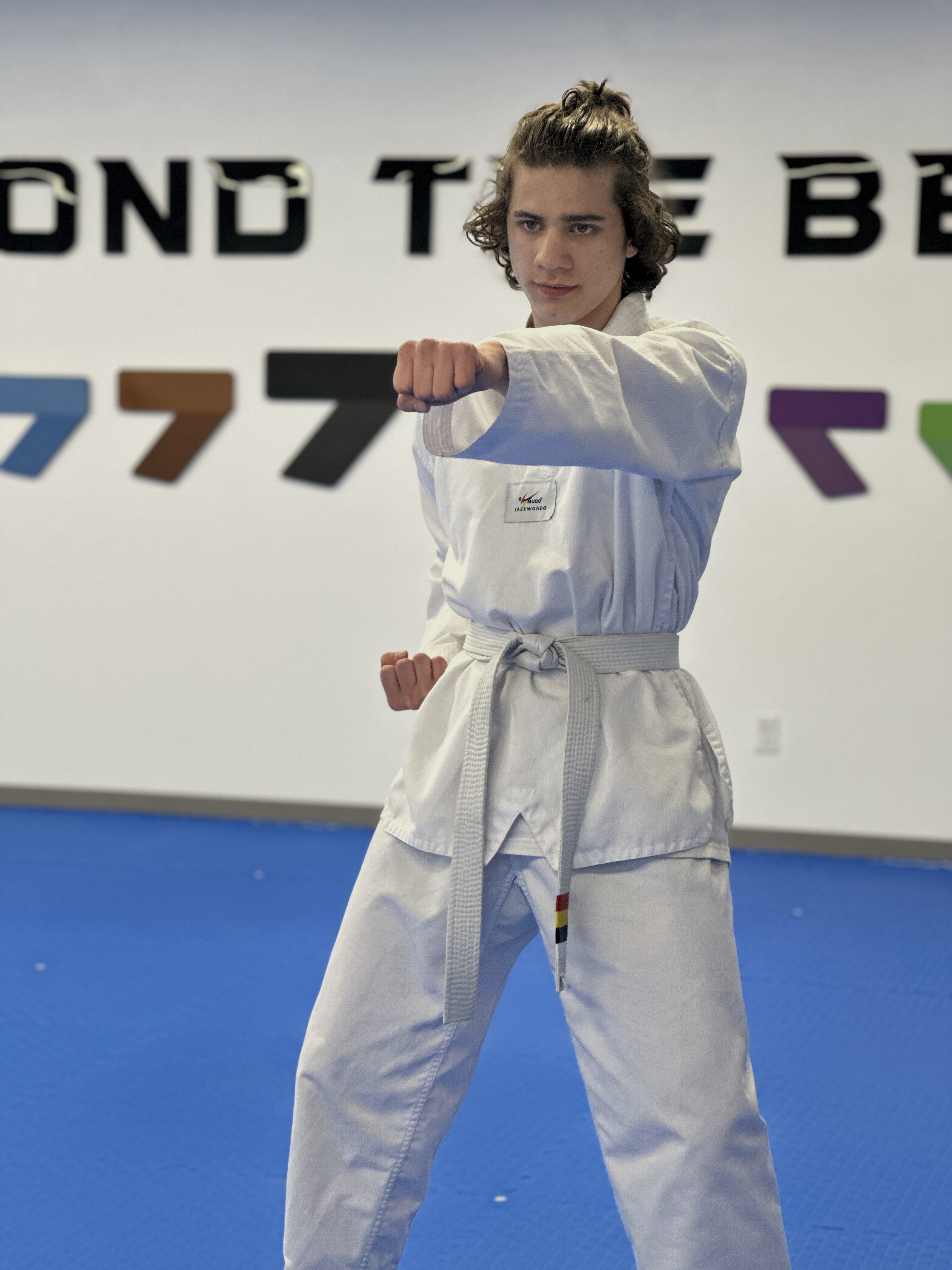 Adult student practicing kicking technique in a Taekwondo class at Unity Taekwondo Chilliwack