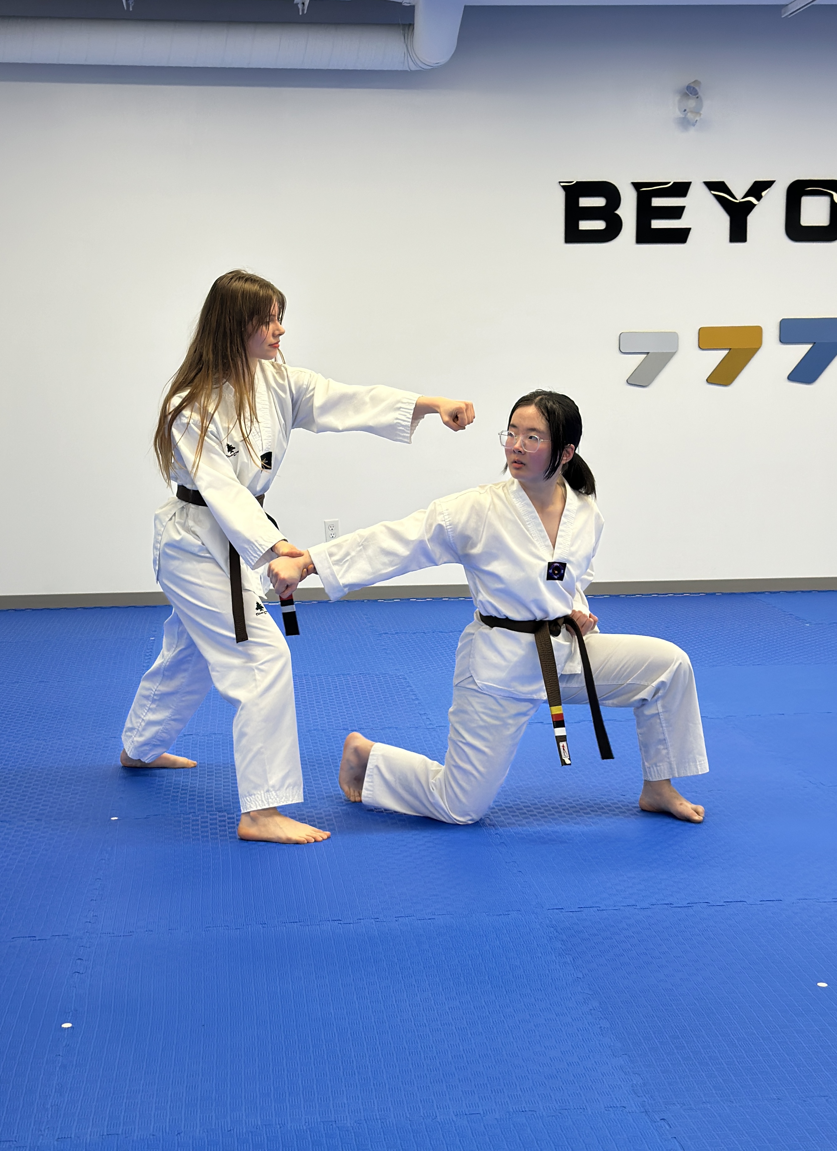 Teen and adult students training together during a Taekwondo class at Unity Taekwondo Chilliwack