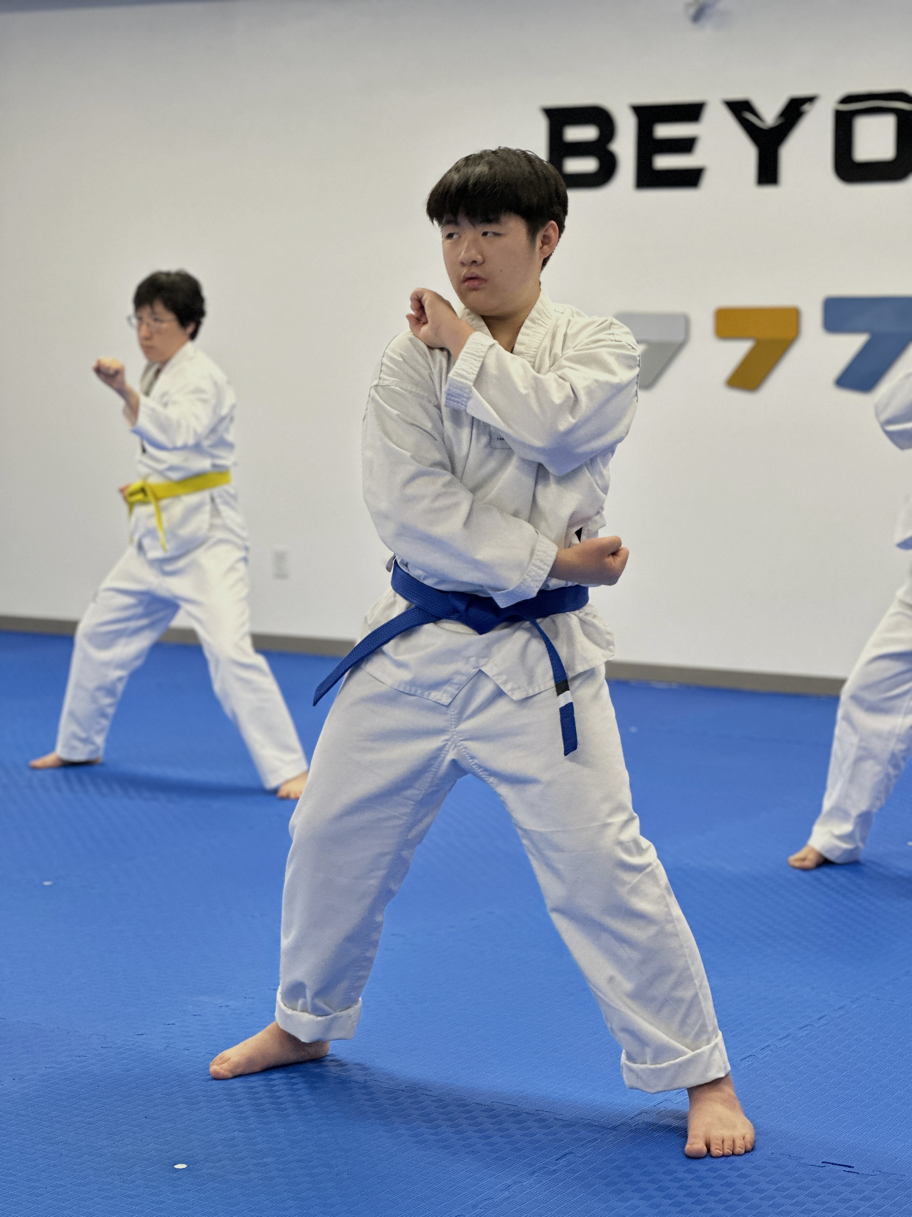Teen student practicing a Taekwondo form (poomsae) at Unity Taekwondo