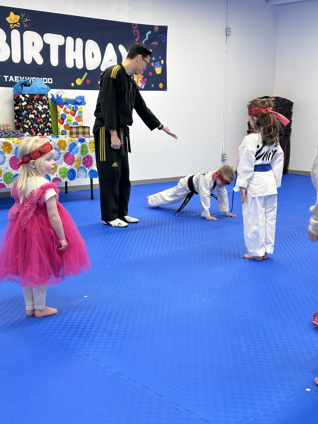 Child performing a Taekwondo kick at a birthday party at Unity Taekwondo Chilliwack